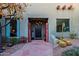 Charming entryway with a unique door and stone pathway at 38844 N Spur Cross Rd, Cave Creek, AZ 85331