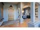 Bright entryway with a rustic wooden door and tiled floor at 38844 N Spur Cross Rd, Cave Creek, AZ 85331