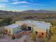 Another view of the home's exterior with a courtyard and mountain views at 38844 N Spur Cross Rd, Cave Creek, AZ 85331