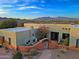 View of home's exterior showcasing a courtyard entry and mountain views at 38844 N Spur Cross Rd, Cave Creek, AZ 85331