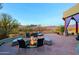 Enjoy the fire pit and mountain views from this amazing patio at 38844 N Spur Cross Rd, Cave Creek, AZ 85331