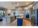 Modern kitchen with stainless steel appliances and an island at 38844 N Spur Cross Rd, Cave Creek, AZ 85331