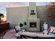 Cozy patio with fireplace and seating area at 38844 N Spur Cross Rd, Cave Creek, AZ 85331