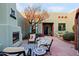 Relaxing patio with fireplace and seating area at 38844 N Spur Cross Rd, Cave Creek, AZ 85331