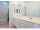 Bathroom with dual sinks and a bathtub at 3982 E Sandpiper Dr, Phoenix, AZ 85050