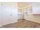 Ample closet space with custom shelving and hanging rods at 3982 E Sandpiper Dr, Phoenix, AZ 85050