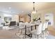 Open concept dining area with a modern chandelier and seating for six at 3982 E Sandpiper Dr, Phoenix, AZ 85050