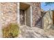 Stone facade with an ornate metal door and steps leading to the entrance at 3982 E Sandpiper Dr, Phoenix, AZ 85050