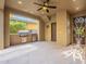 Covered patio with a built-in grill and access to the backyard at 3982 E Sandpiper Dr, Phoenix, AZ 85050