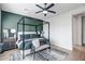 Main bedroom with a canopy bed and green accent wall at 40715 N Lytham Ct, Phoenix, AZ 85086