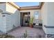 Inviting front entry with wrought iron gate, stone accents, and a relaxing bench at 40715 N Lytham Ct, Phoenix, AZ 85086