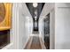 Bright hallway with designer runner and black doors at 40715 N Lytham Ct, Phoenix, AZ 85086