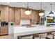 Modern kitchen with white quartz countertops and a stainless steel range at 40715 N Lytham Ct, Phoenix, AZ 85086