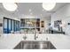 Modern kitchen island with a built-in sink and bar seating at 40715 N Lytham Ct, Phoenix, AZ 85086