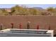 Close up of the spa with decorative tile accents, plants, and a mountain view at 40715 N Lytham Ct, Anthem, AZ 85086