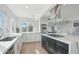 Modern kitchen with white cabinets, stainless steel appliances, and an island at 4344 E Desert Crest Dr, Paradise Valley, AZ 85253