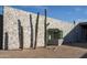 Modern home exterior with stone wall and cacti at 5120 N Casa Blanca Dr, Paradise Valley, AZ 85253