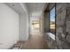 Hallway with stone feature wall and hardwood floors at 5120 N Casa Blanca Dr, Paradise Valley, AZ 85253