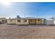 House backyard view with gravel, shed, and clear sky at 5452 E University Dr, Mesa, AZ 85205