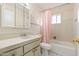 Clean bathroom with updated vanity and bathtub at 5452 E University Dr, Mesa, AZ 85205