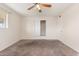 Spacious bedroom with ceiling fan and ample closet space at 5452 E University Dr, Mesa, AZ 85205