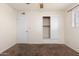 Well-lit bedroom with mirrored closet doors and carpet flooring at 5452 E University Dr, Mesa, AZ 85205