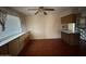 Dining area with tiled floor, built-in cabinetry, and ceiling fan at 5452 E University Dr, Mesa, AZ 85205