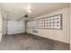 Garage with overhead door and decorative block windows at 5452 E University Dr, Mesa, AZ 85205