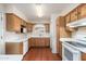 Bright kitchen with wood cabinets and tile floor at 5452 E University Dr, Mesa, AZ 85205