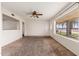 Living room with large window and view of the street at 5452 E University Dr, Mesa, AZ 85205