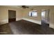 Living room featuring neutral carpeting and a pass-through to kitchen at 5452 E University Dr, Mesa, AZ 85205