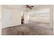 Spacious living room with carpet and ceiling fan at 5452 E University Dr, Mesa, AZ 85205