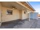 Covered patio adjacent to house and storage shed at 5452 E University Dr, Mesa, AZ 85205