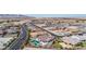 Aerial view of houses in a community, showcasing a house with a pool at 5609 W Posse Dr, Eloy, AZ 85131