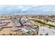 An aerial view showing a community with a golf course and houses at 5609 W Posse Dr, Eloy, AZ 85131