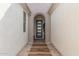 Covered entryway with arched doorway and tile flooring at 5609 W Posse Dr, Eloy, AZ 85131