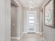 Bright and airy entryway with modern light fixture at 5609 W Posse Dr, Eloy, AZ 85131