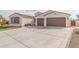 Two-car garage and nicely landscaped front yard at 5609 W Posse Dr, Eloy, AZ 85131