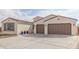 Two-car garage and nicely landscaped front yard at 5609 W Posse Dr, Eloy, AZ 85131