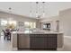 Kitchen island with seating and views into Gathering room at 5609 W Posse Dr, Eloy, AZ 85131