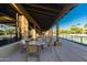 Patio area with tables and chairs overlooking tennis courts at 5609 W Posse Dr, Eloy, AZ 85131