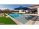 Stunning pool with blue umbrellas and comfortable lounge chairs at 5609 W Posse Dr, Eloy, AZ 85131