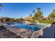 Resort-style pool with cabanas and palm trees at 5609 W Posse Dr, Eloy, AZ 85131