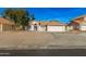 Single-story house with a two-car garage and desert landscaping at 6634 E Preston St, Mesa, AZ 85215