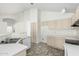 Kitchen features light-toned cabinetry and tile flooring at 6634 E Preston St, Mesa, AZ 85215