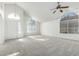 Spacious living room featuring vaulted ceilings and carpet flooring at 6634 E Preston St, Mesa, AZ 85215