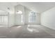 Bright living room with vaulted ceilings and neutral carpet at 6634 E Preston St, Mesa, AZ 85215