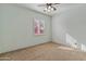 Well-lit bedroom with plantation shutters and ceiling fan at 7110 W Villa Lindo Dr, Peoria, AZ 85383