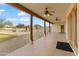 Covered patio with tile flooring and ceiling fans at 7110 W Villa Lindo Dr, Peoria, AZ 85383