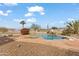 Relaxing pool area with a waterfall and diving board, perfect for outdoor enjoyment at 7110 W Villa Lindo Dr, Peoria, AZ 85383